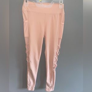 soft S/M pink leggings, brand new never worn, mesh sides and side pockets.